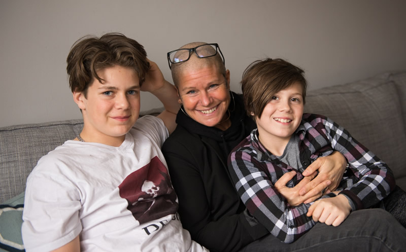A photo of Erin Benjamin hanging out with her two kids.