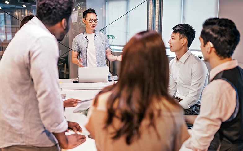 A photo of people in a classroom setting learning from an instructor.