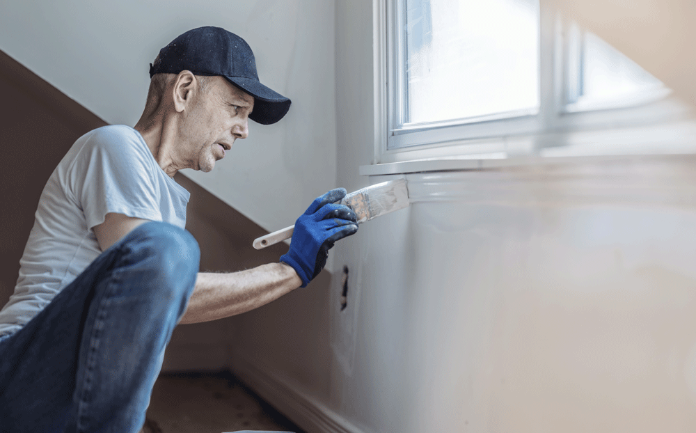 Senior citizen working to restore a home.