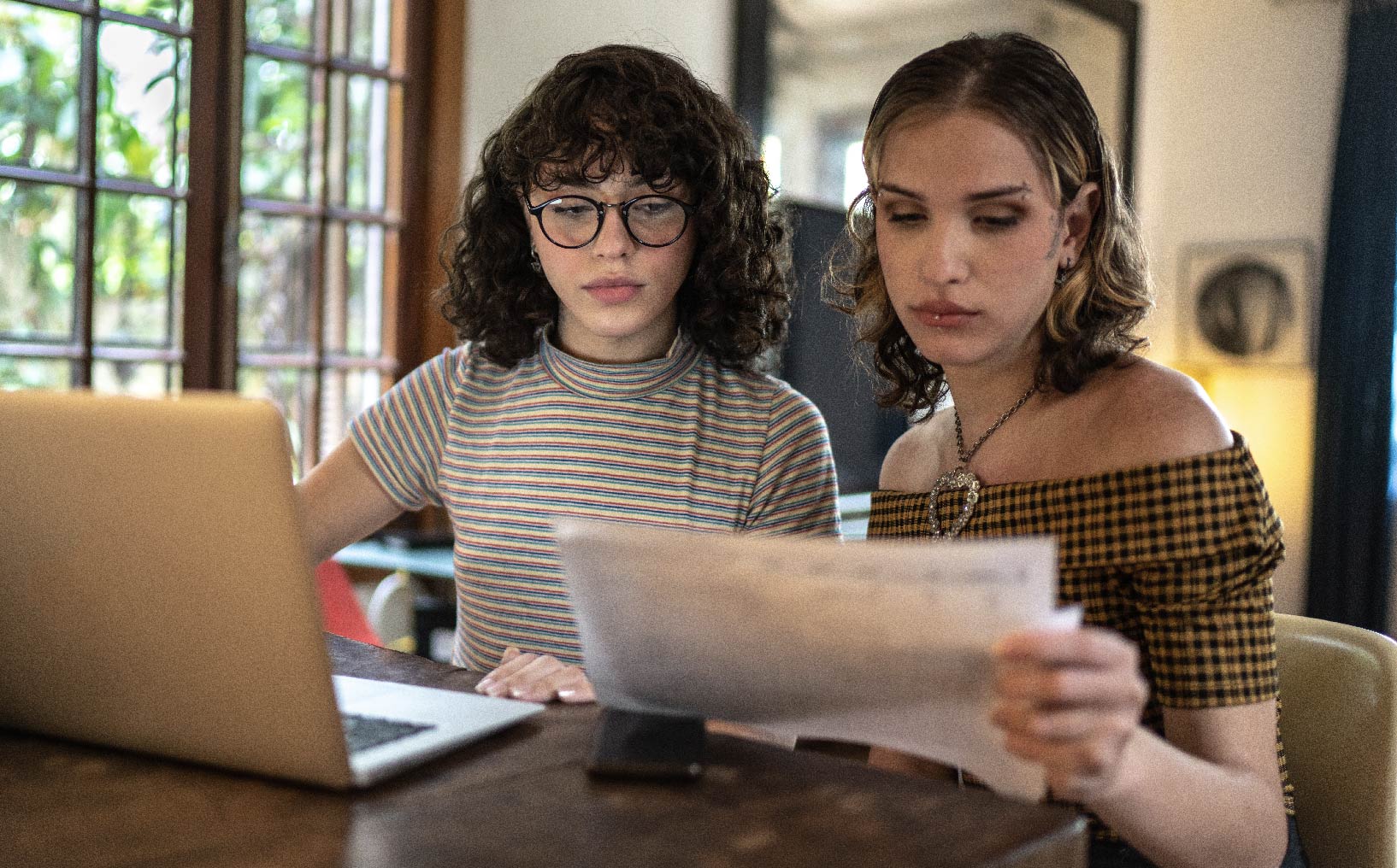 Young people looking over their budget