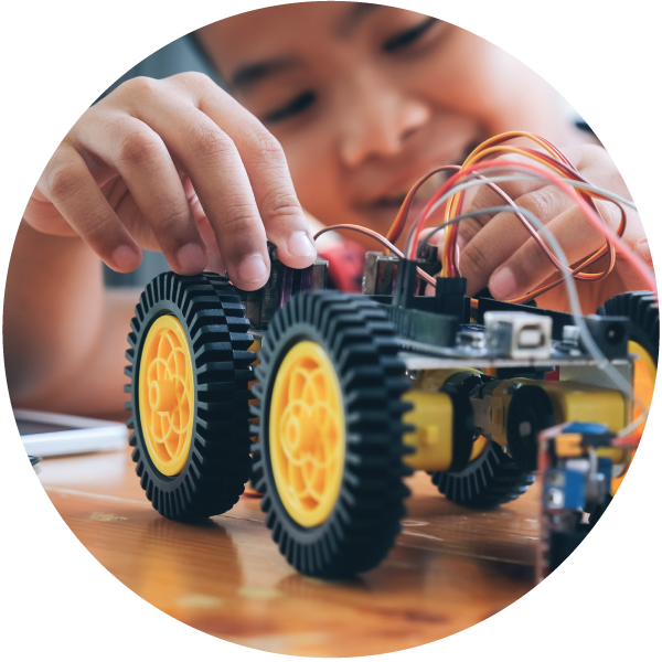 A photo of a child playing with a toy tractor.